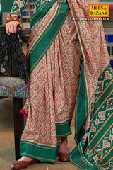 Peach Silk Saree with Green Border– Vintage Patola Printed Designer Saree