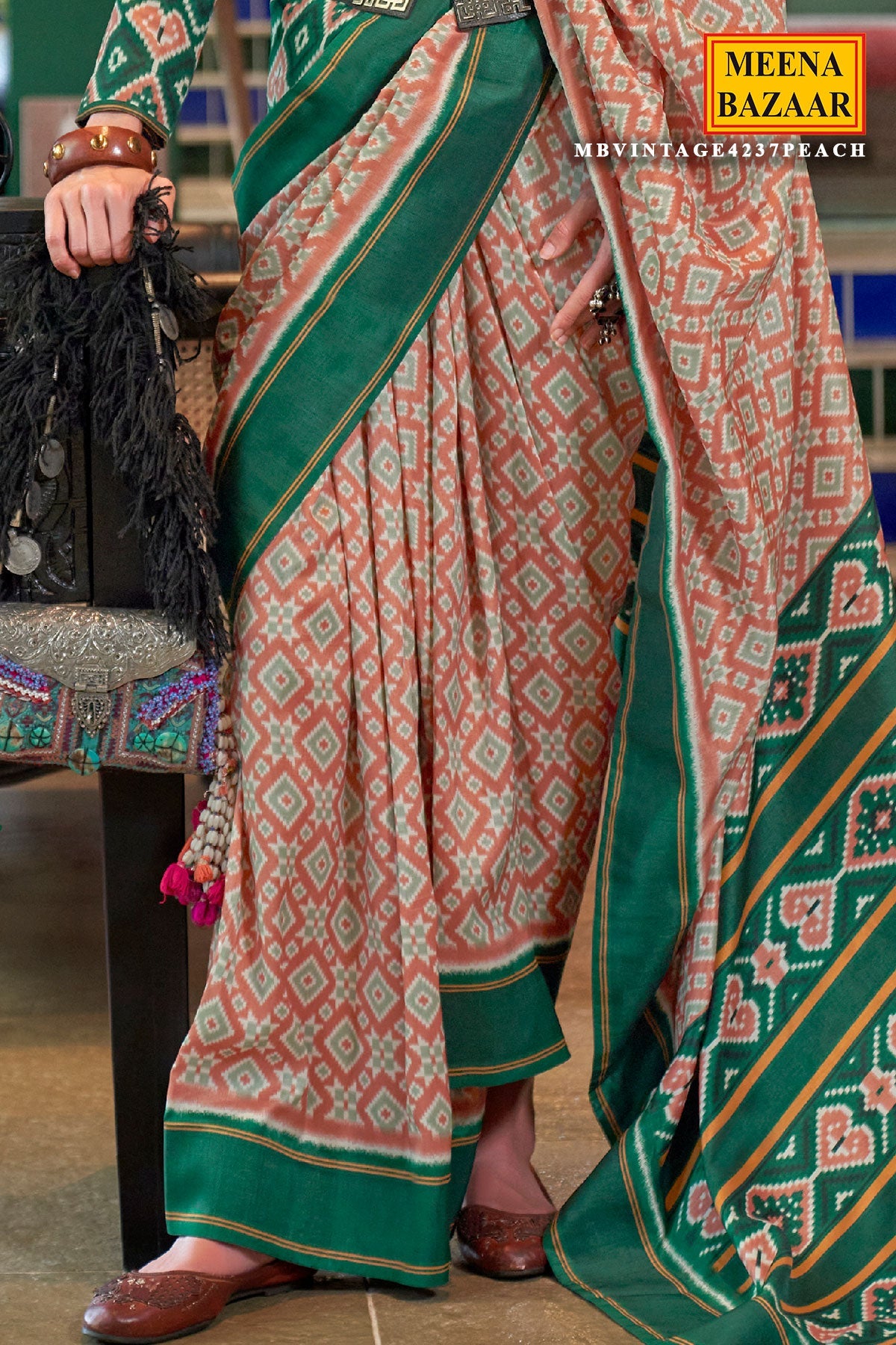 Peach Silk Saree with Green Border– Vintage Patola Printed Designer Saree